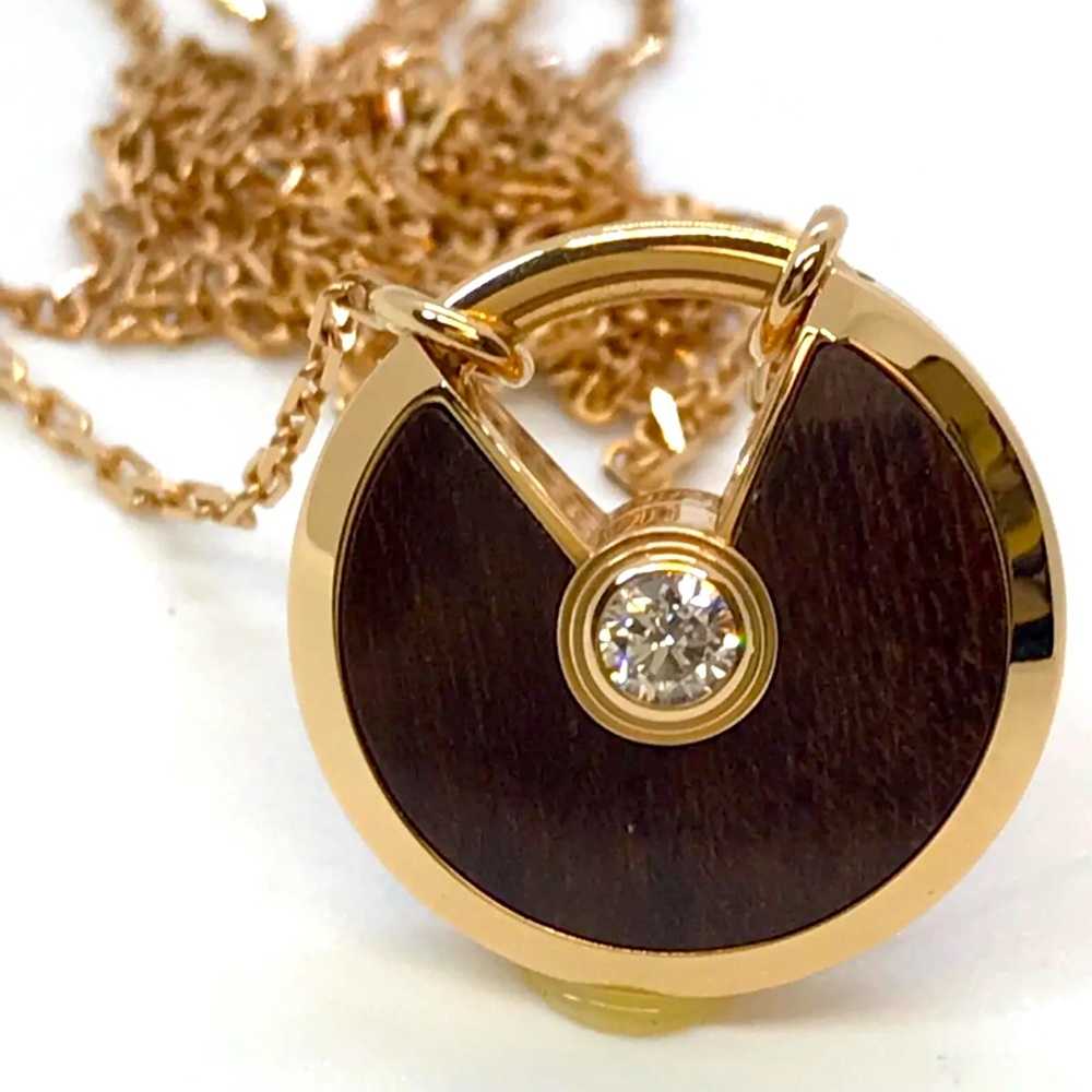 AMULETTE DE CARTIER NECKLACE, SMALL, Rose Gold, Snakewood, and Diamond.